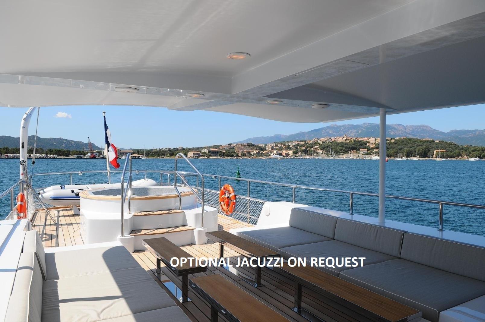 Luxurious Explorer trawler 33m yacht deck with optional jacuzzi, scenic ocean view, 2005 model.