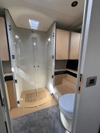  Yacht Photos Pics Vismara V78 2004 yacht bathroom with modern shower and toilet.