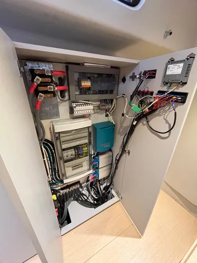  Yacht Photos Pics Electrical panel inside a 2004 Vismara V78 yacht, showcasing wiring and components.