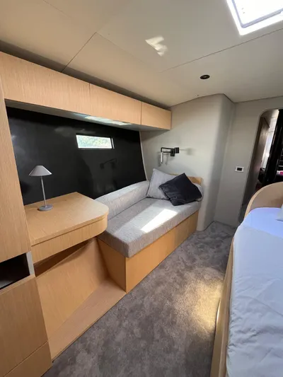  Yacht Photos Pics Luxurious interior of 2004 Vismara V78 yacht with modern furnishings and cozy seating area.