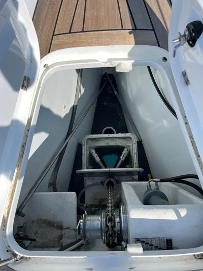  Yacht Photos Pics Anchor compartment of 2004 Vismara V78 yacht with visible winch and chain.