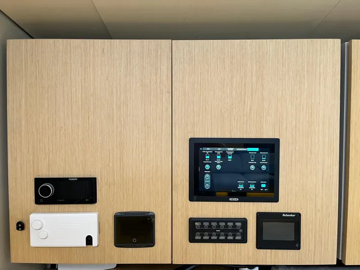  Yacht Photos Pics Control panel of a 2004 Vismara V78 yacht with various electronic interfaces.