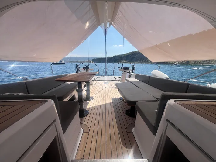  Yacht Photos Pics Luxurious 2004 Vismara V78 yacht interior with elegant seating and scenic ocean view.