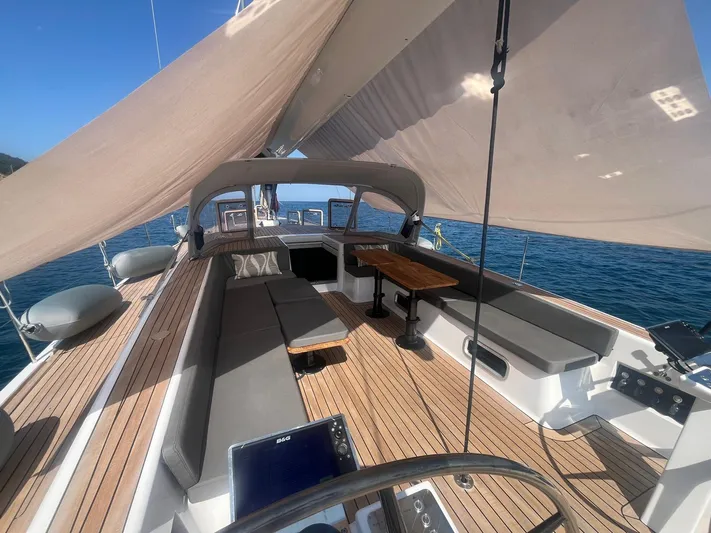  Yacht Photos Pics Luxurious 2004 Vismara V78 yacht interior with sleek seating and wooden deck.