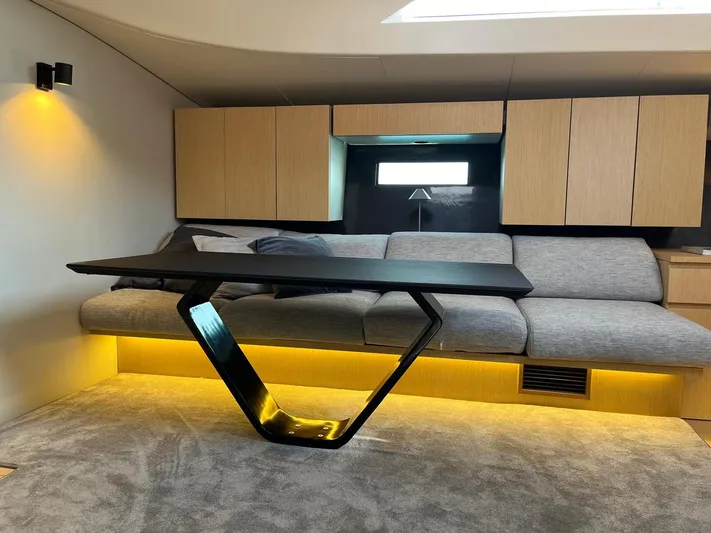  Yacht Photos Pics Modern interior of 2004 Vismara V78 yacht with sleek furniture and ambient lighting.