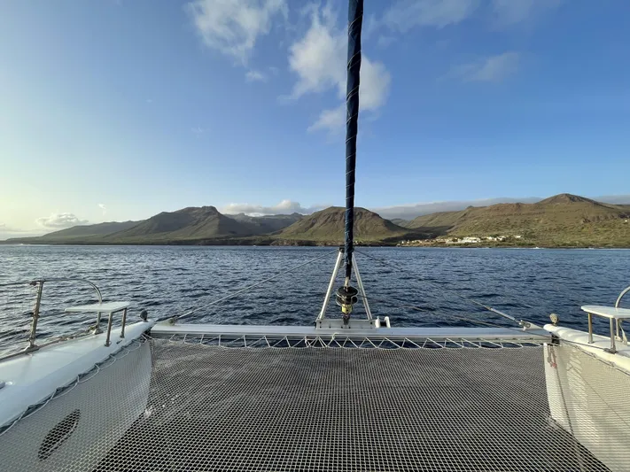  Yacht Photos Pics Catamaran Fountaine Pajot Bahia 46 sailing with mountain view, 2006 model.