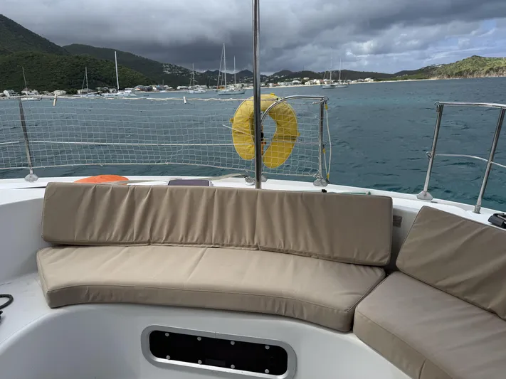  Yacht Photos Pics Fountaine Pajot Bahia 46 catamaran deck with seating, ocean view, and life preserver, 2006 model.