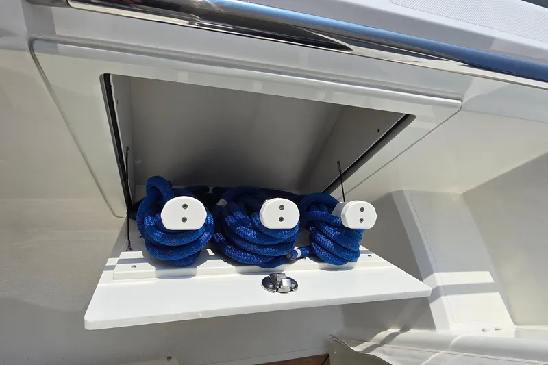 Princess Gia Yacht Photos Pics Storage compartment with blue ropes on a 2021 Tiara Sport 43 LS boat.