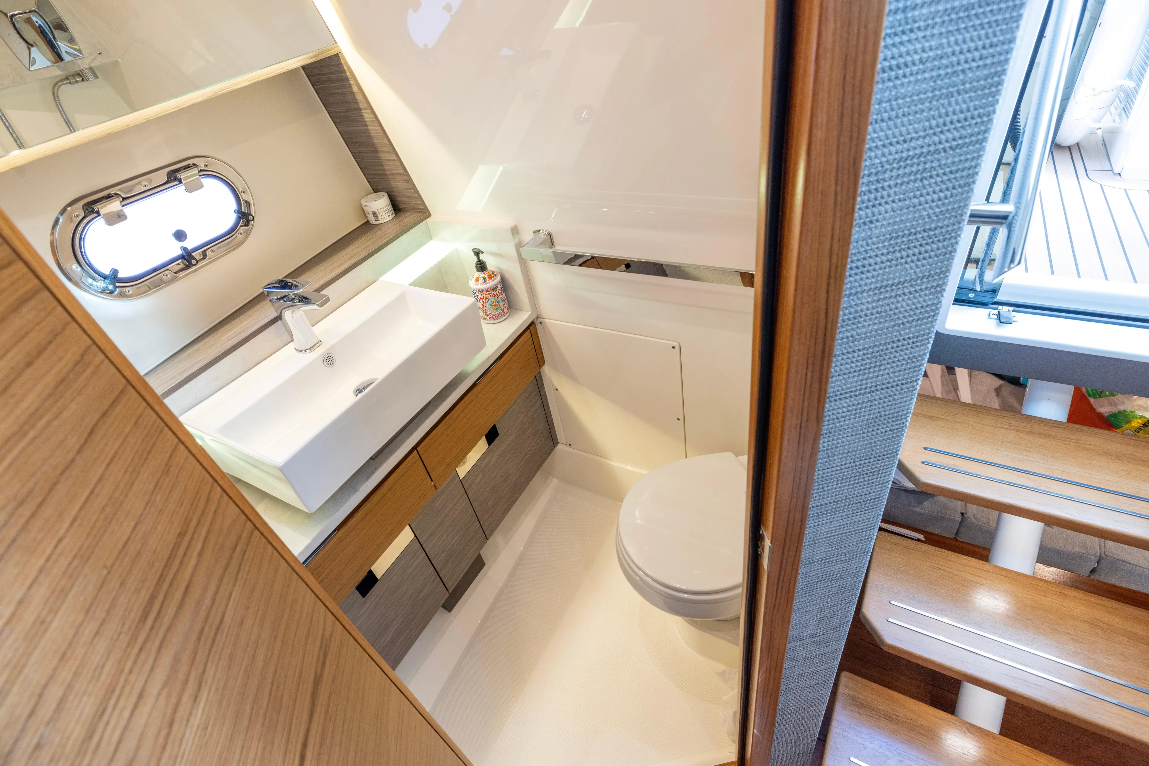 Princess Gia Yacht Photos Pics Luxurious bathroom interior of 2021 Tiara Yachts 43 LS, featuring modern sink and toilet.