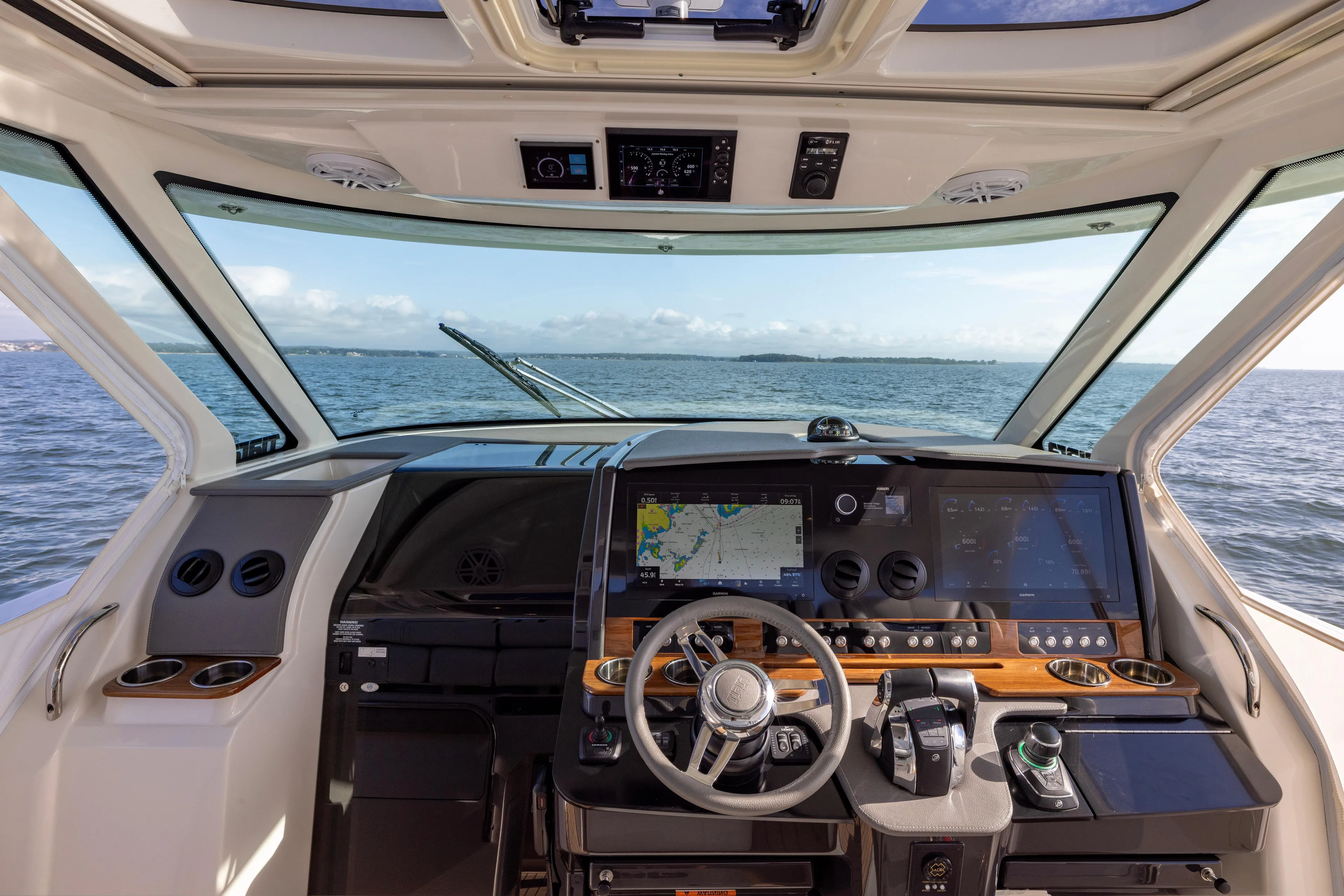 Princess Gia Yacht Photos Pics Interior view of 2021 Tiara Yachts 43 LS helm with advanced navigation system.