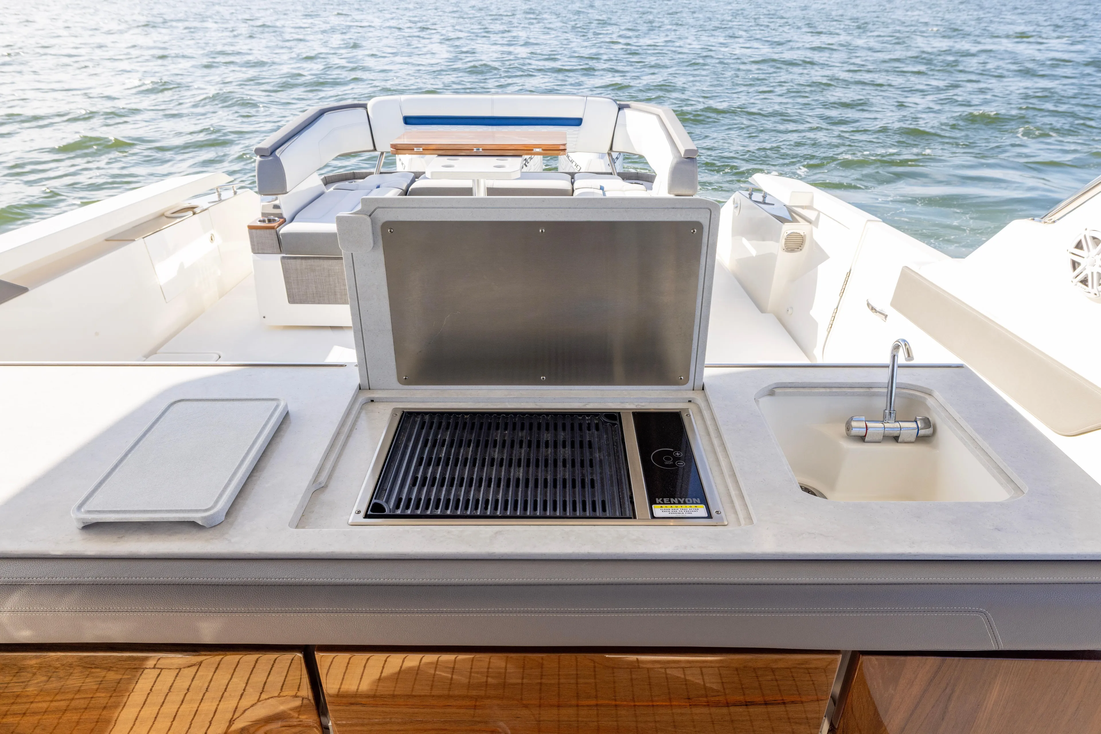 Princess Gia Yacht Photos Pics 2021 Tiara Yachts 43 LS with outdoor grill and sink, overlooking the water.