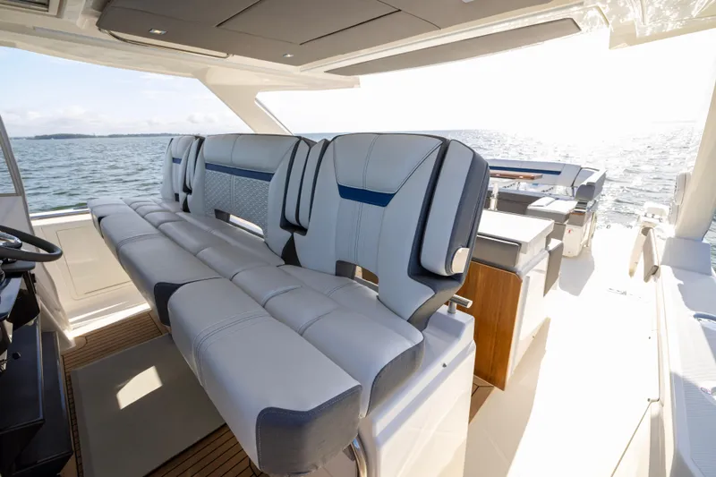 Princess Gia Yacht Photos Pics Luxurious seating on 2021 Tiara Yachts 43 LS, overlooking serene ocean waters.