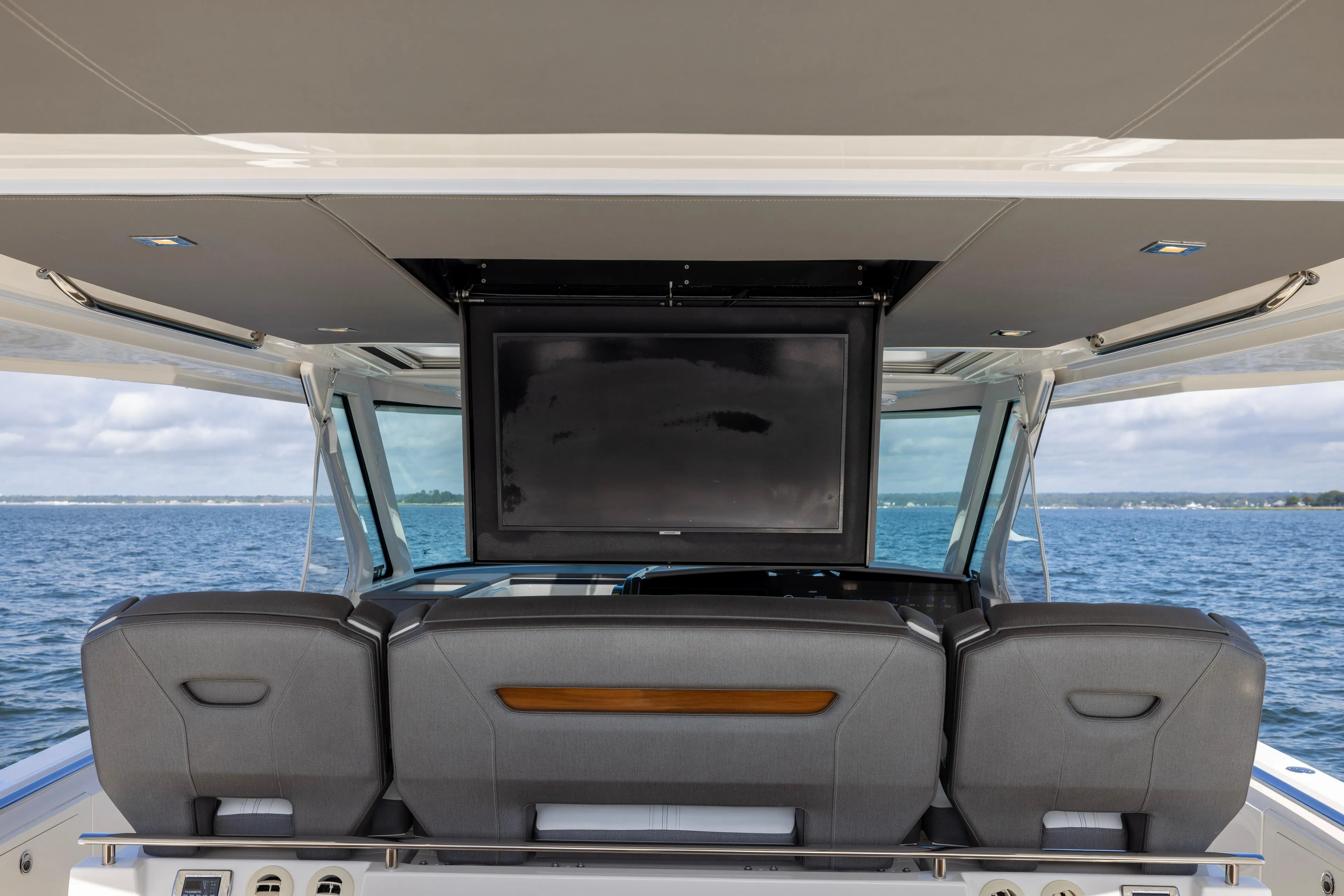 Princess Gia Yacht Photos Pics 2021 Tiara Yachts 43 LS interior with TV, ocean view, and luxury seating.