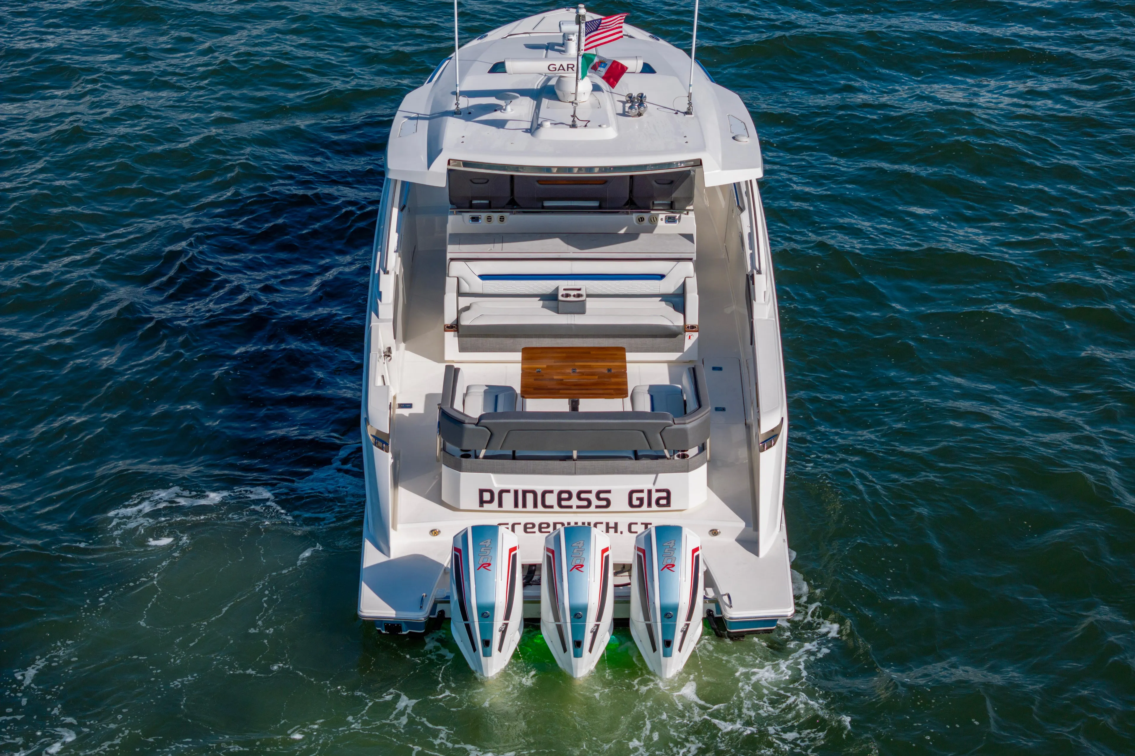 Princess Gia Yacht Photos Pics 2021 Tiara Yachts 43 LS on water, rear view with triple engines.