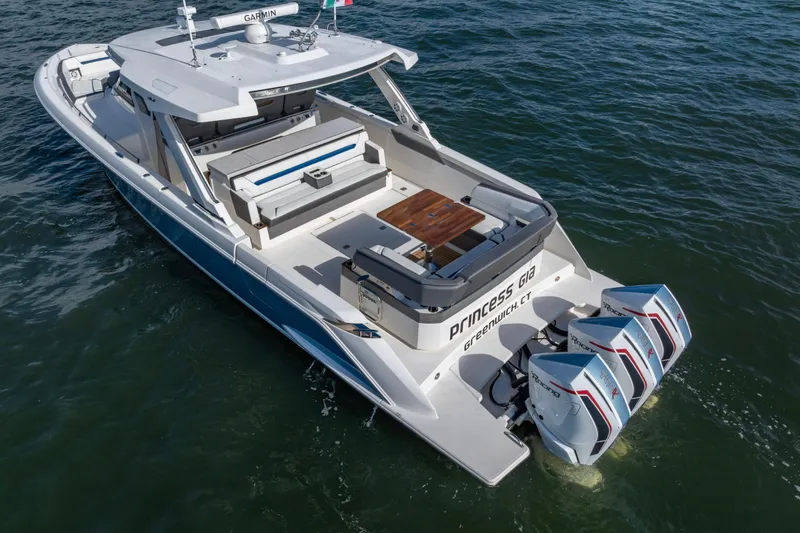 Princess Gia Yacht Photos Pics 2021 Tiara Yachts 43 LS boat with triple outboard engines on water.
