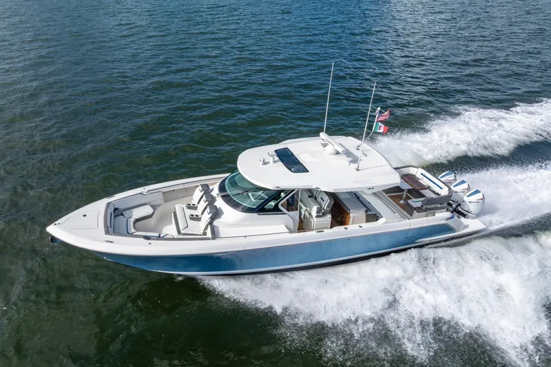 Princess Gia Yacht Photos Pics 2021 Tiara Yachts 43 LS cruising on open water, showcasing sleek design and powerful engines.