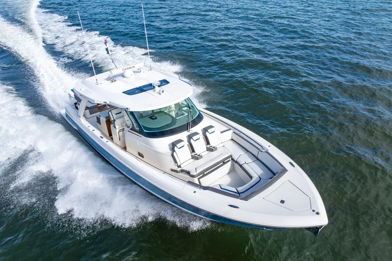 Princess Gia Yacht Photos Pics 2021 Tiara Yachts 43 LS cruising on open water, showcasing sleek design and performance.