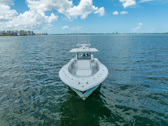  Yacht Photos Pics 2023 Yellowfin 39 Offshore boat on open water under a partly cloudy sky.