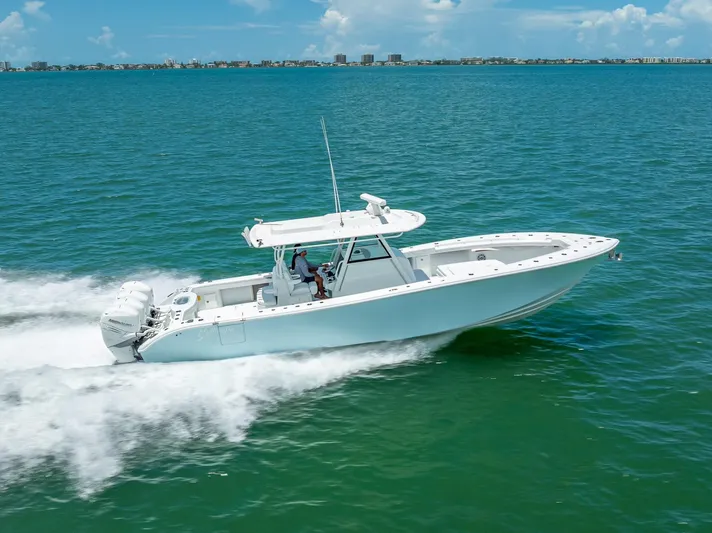  Yacht Photos Pics 2023 Yellowfin 39 Offshore boat cruising on open water, showcasing sleek design and performance.