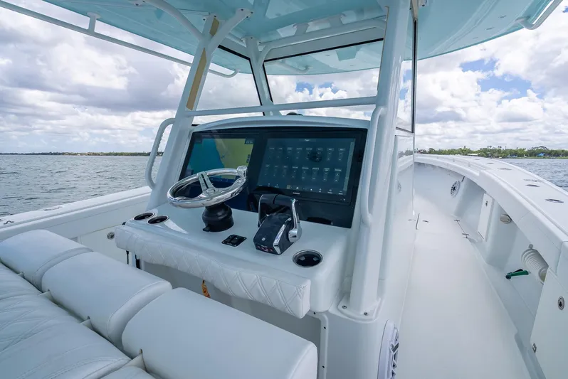  Yacht Photos Pics 2023 Yellowfin 39 Offshore boat cockpit with modern controls and steering wheel.