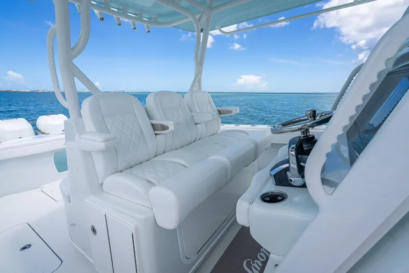  Yacht Photos Pics 2023 Yellowfin 39 Offshore boat interior with white seating and ocean view.