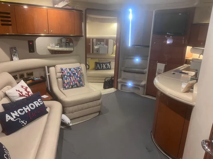 Phantom Yacht Photos Pics Interior of 2000 Sea Ray 460 Sundancer yacht with plush seating and nautical decor.