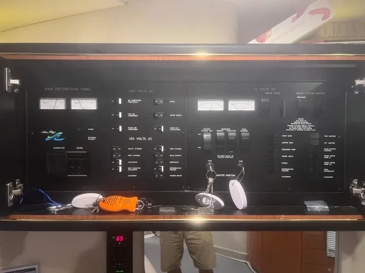 Phantom Yacht Photos Pics Control panel of a 2000 Sea Ray 460 Sundancer yacht with various switches and gauges.