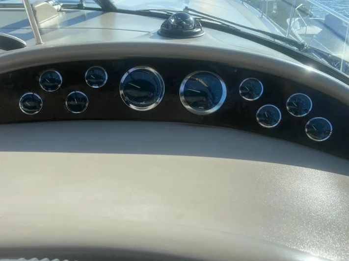 Phantom Yacht Photos Pics Dashboard of a 2000 Sea Ray 460 Sundancer boat with multiple gauges.