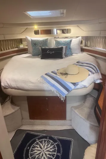 Phantom Yacht Photos Pics Luxurious cabin interior of 2000 Sea Ray 460 Sundancer yacht with cozy bedding.