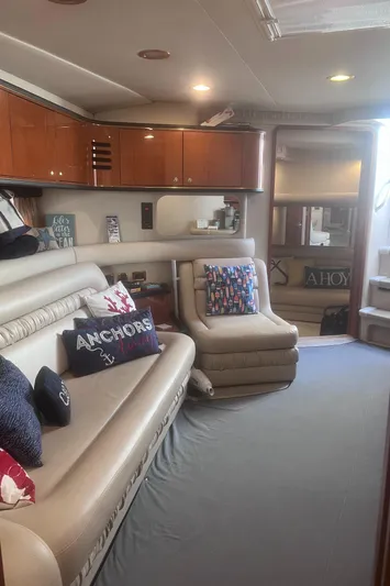 Phantom Yacht Photos Pics Interior of 2000 Sea Ray 460 Sundancer yacht with plush seating and nautical decor.