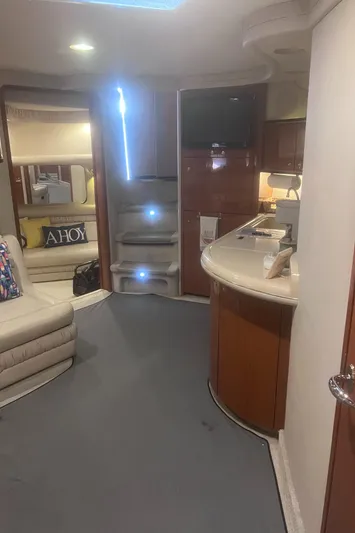 Phantom Yacht Photos Pics Interior of 2000 Sea Ray 460 Sundancer yacht with modern furnishings and ambient lighting.