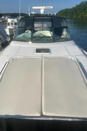 Phantom Yacht Photos Pics 2000 Sea Ray 460 Sundancer yacht docked in a serene marina setting.