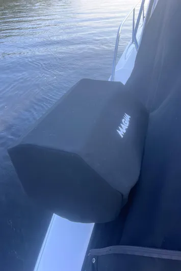 Phantom Yacht Photos Pics 2000 Sea Ray 460 Sundancer with protective cover on calm water.