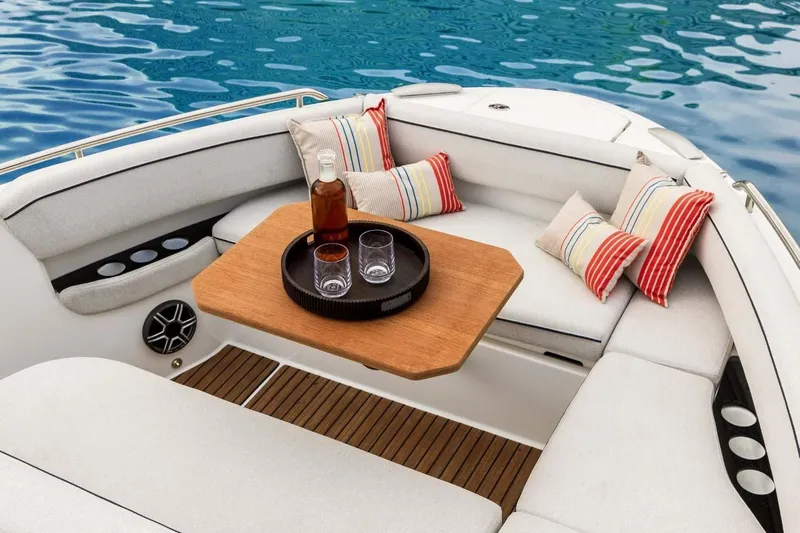  Yacht Photos Pics Manufacturer Provided Image: Luxurious seating area on 2025 Beneteau Gran Turismo 35 yacht with drinks and cushions.