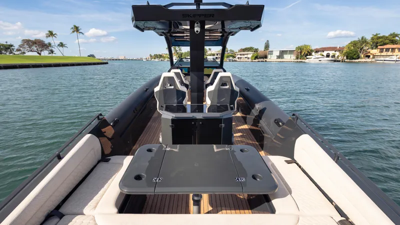 New 2025 Skipper 38 Twin 500 Yacht Photos Pics 2025 Skipper 38 boat on water, featuring sleek design and comfortable seating.