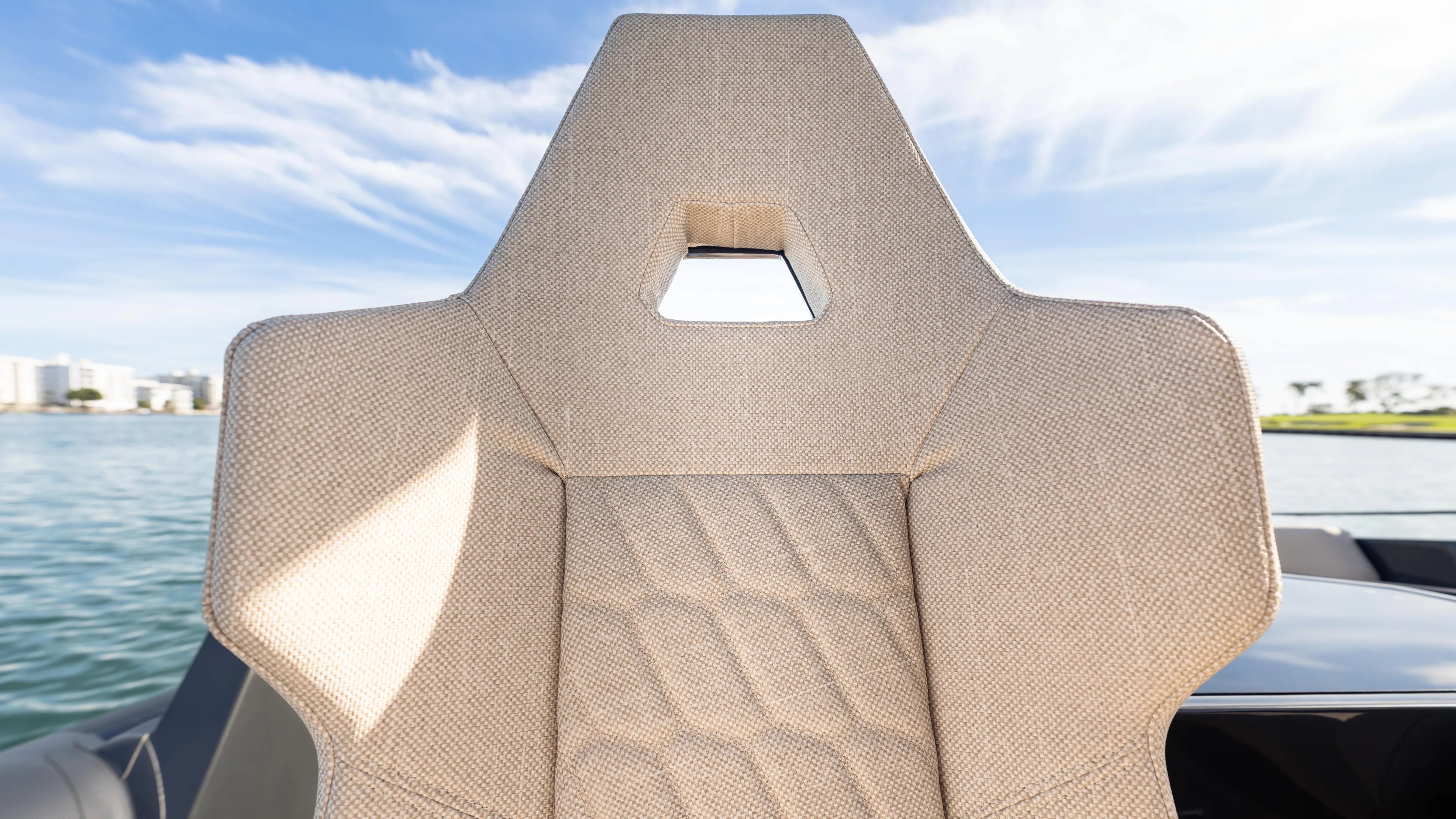 New 2025 Skipper 38 Twin 500 Yacht Photos Pics Modern Skipper 38 boat seat, 2025 model, with geometric design and water backdrop.