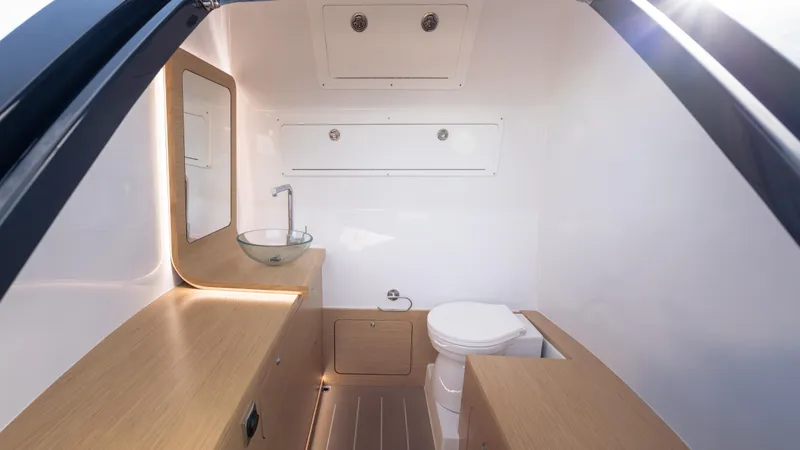 New 2025 Skipper 38 Twin 500 Yacht Photos Pics Modern bathroom interior of 2025 Skipper 38 boat, featuring sleek design and wooden accents.