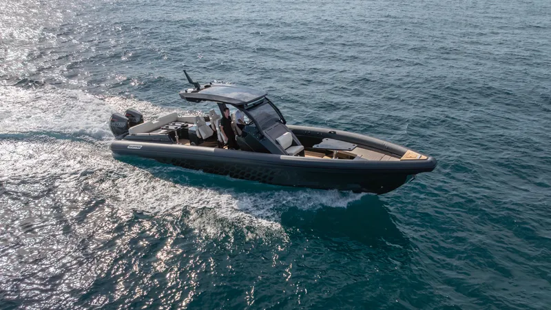 New 2025 Skipper 38 Twin 500 Yacht Photos Pics 2025 Skipper 38 boat cruising on open water.