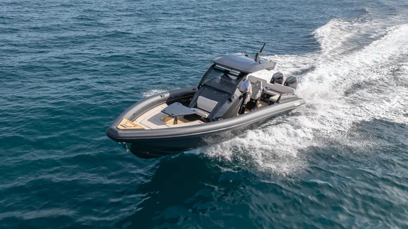 New 2025 Skipper 38 Twin 500 Yacht Photos Pics 2025 Skipper 38 boat cruising on open sea, showcasing sleek design and performance.