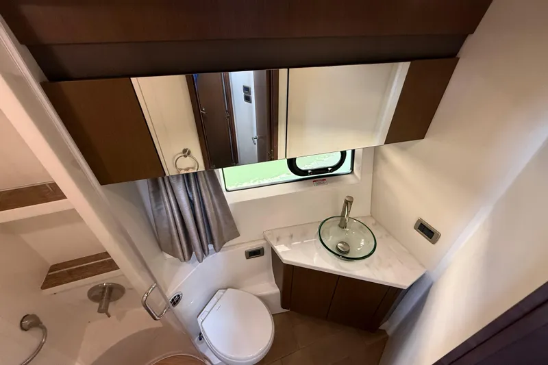 Tea Time III Yacht Photos Pics Luxurious bathroom in 2018 Sea Ray Fly 400 yacht with modern fixtures and elegant design.