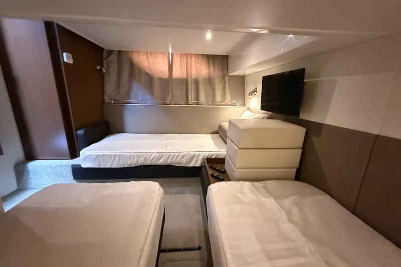 Tea Time III Yacht Photos Pics Luxurious cabin interior of 2018 Sea Ray Fly 400 yacht with twin beds and TV.