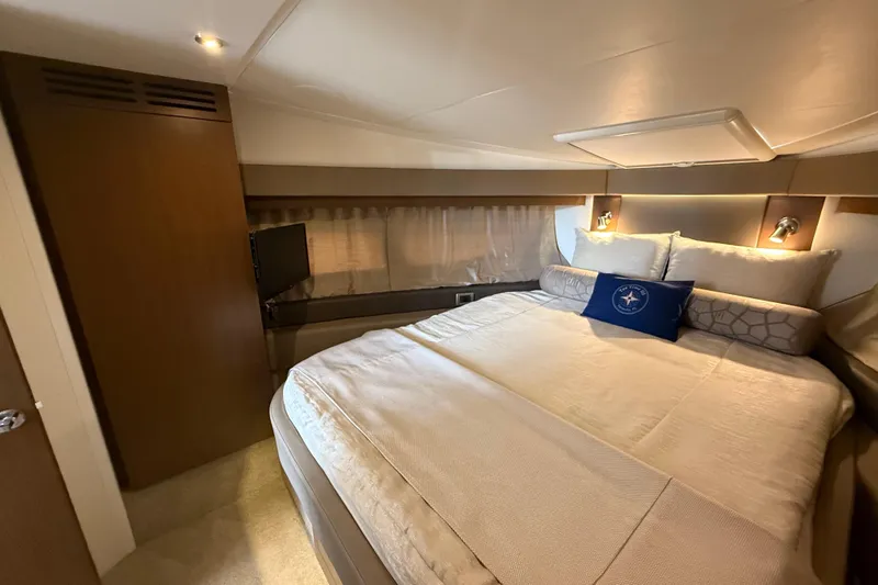 Tea Time III Yacht Photos Pics Luxurious bedroom interior of 2018 Sea Ray Fly 400 yacht with cozy bedding.