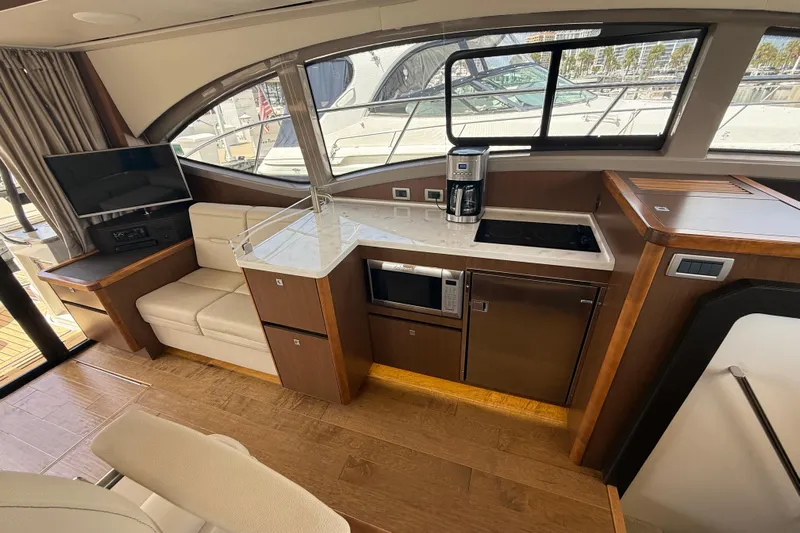 Tea Time III Yacht Photos Pics Luxurious interior of 2018 Sea Ray Fly 400 yacht with modern kitchen and seating area.