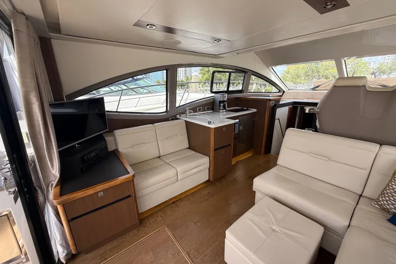 Tea Time III Yacht Photos Pics Luxurious interior of 2018 Sea Ray Fly 400 yacht with modern seating and kitchenette.