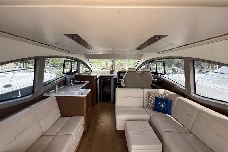 Tea Time III Yacht Photos Pics Luxurious interior of 2018 Sea Ray Fly 400 yacht with modern seating and helm.