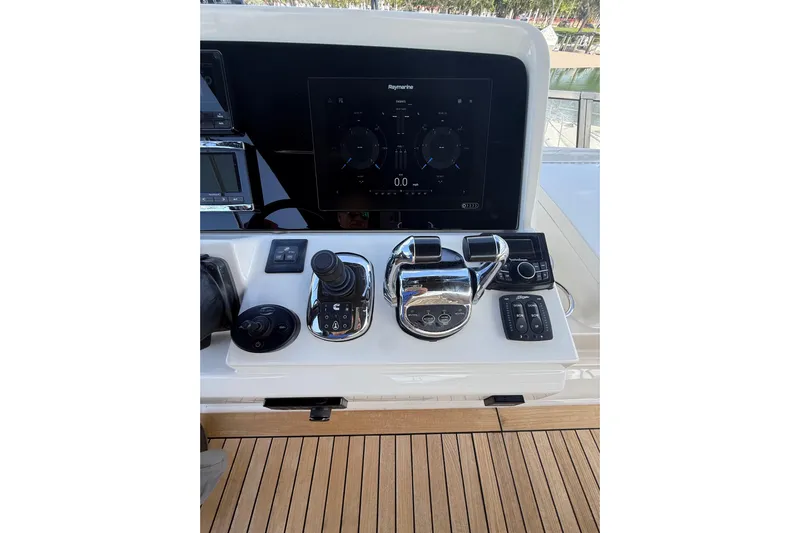 Tea Time III Yacht Photos Pics Control panel of 2018 Sea Ray Fly 400 yacht with navigation and throttle controls.