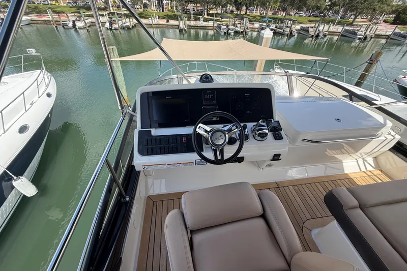 Tea Time III Yacht Photos Pics 2018 Sea Ray Fly 400 yacht helm with modern controls and waterfront view.
