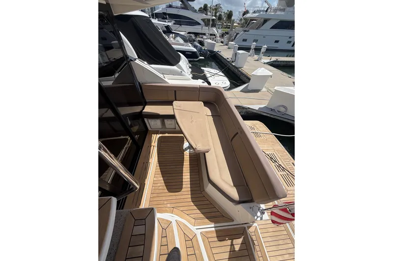 Tea Time III Yacht Photos Pics 2018 Sea Ray Fly 400 yacht with teak deck and cushioned seating at marina.