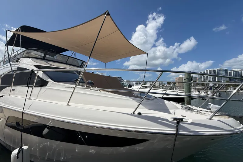 Tea Time III Yacht Photos Pics 2018 Sea Ray Fly 400 yacht docked under a sunny sky.