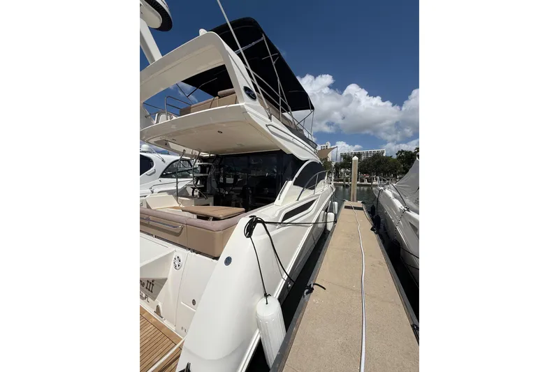 Tea Time III Yacht Photos Pics 2018 Sea Ray Fly 400 yacht docked at marina under clear blue sky.
